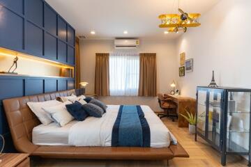 Stylish modern bedroom with king-sized bed and decorative interior