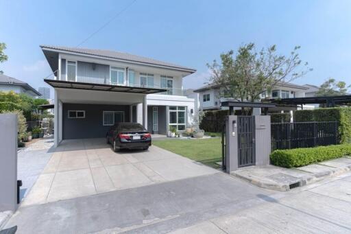 Modern two-story house with spacious driveway and garage