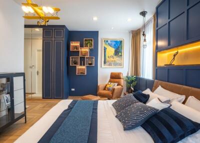 Stylish modern bedroom with elegant decor and ample lighting