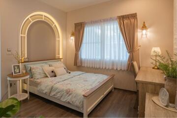 Cozy bedroom with natural light and elegant decor