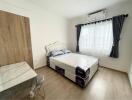 Bright and modernly furnished bedroom with air conditioning