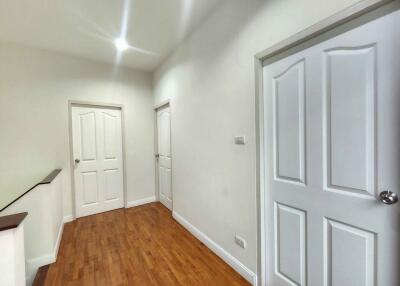Bright hallway with wooden flooring