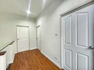 Bright hallway with wooden flooring