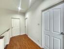 Bright hallway with wooden flooring