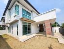 Modern two-story house with an ample front porch and large windows