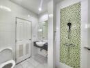 Modern bathroom with green mosaic tiles and shower