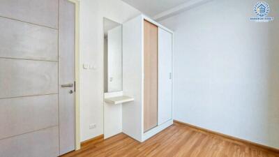 Bright and clean bedroom interior with wooden flooring