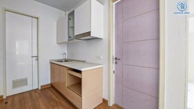 Compact kitchen space with modern appliances and minimalist design