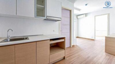 Bright and modern kitchen with wooden cabinets and white interiors