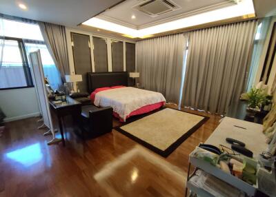 Spacious bedroom with modern design and ample lighting