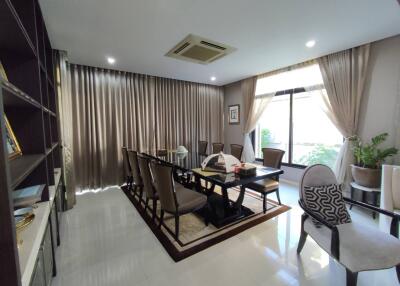 Spacious dining room with large table and modern chairs