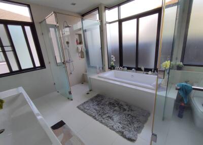 Spacious modern bathroom with tub and separate shower