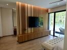 Modern living room with wooden accent wall and contemporary furniture