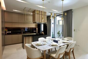 Modern dining area with adjacent open-plan kitchen
