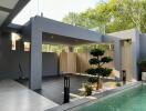 Modern home exterior with swimming pool and carport