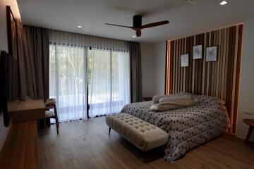 Spacious bedroom with modern design and ample natural light