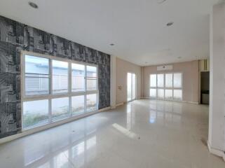 Spacious unfurnished building interiors with large windows and natural light