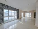 Spacious unfurnished building interiors with large windows and natural light