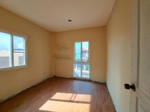 Spacious empty bedroom with ample natural light