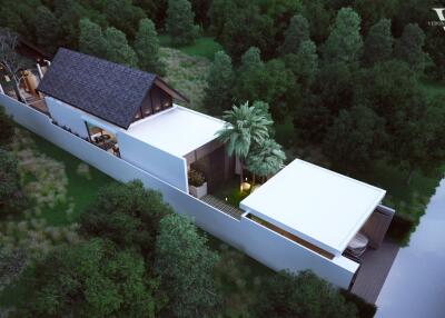 Aerial view of a modern luxury villa surrounded by trees