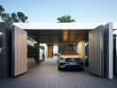 Modern house entrance with carport and luxury car