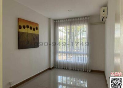 Bright and spacious bedroom with air conditioning and large window