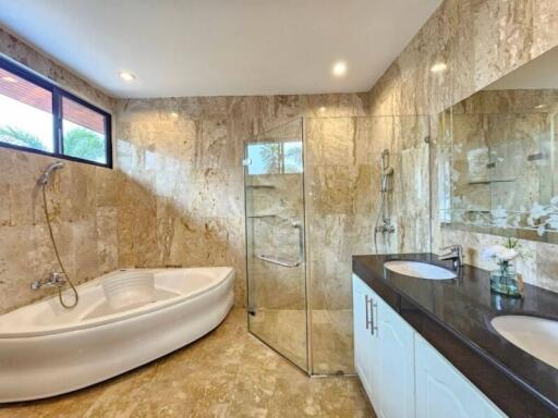 Modern bathroom with walk-in shower and freestanding tub