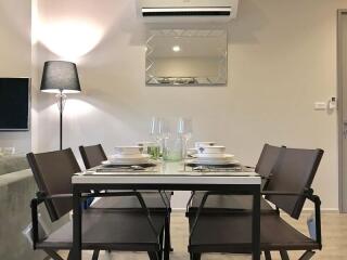 Modern dining room with set table and chairs