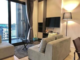 Modern living room with natural lighting and balcony access