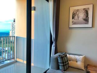 Cozy living room with a balcony and ocean view