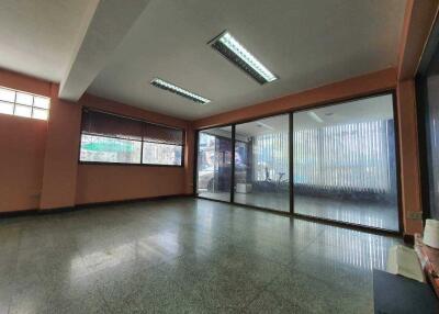 Spacious and well-lit commercial space with large windows