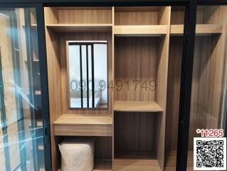 Modern bedroom with wooden built-in wardrobe and vanity