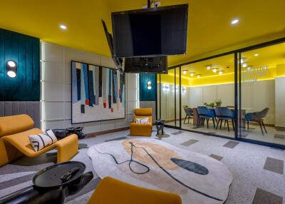 Modern living room with vibrant yellow walls and contemporary decor