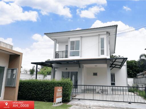 Modern two-story family home with balcony and landscaped front yard