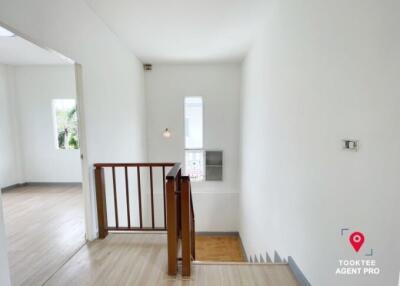 Bright empty room with white walls and wooden floor