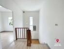 Bright empty room with white walls and wooden floor