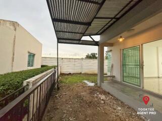 Covered patio area with metal roofing adjacent to the house