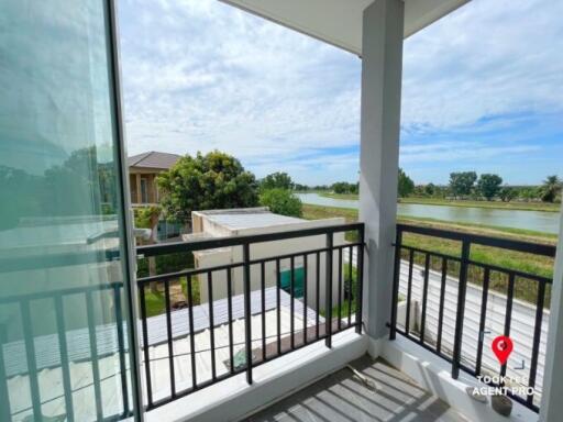 Spacious balcony with scenic lake view, and glass balustrade