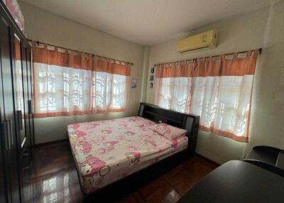 Cozy bedroom with natural light, air conditioning and modern furniture