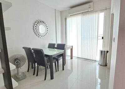 Bright dining area with modern furniture and tiled flooring