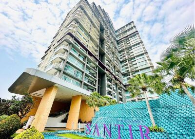 Modern high-rise residential building with distinctive entrance