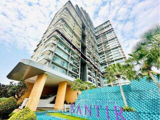 Modern high-rise residential building with distinctive entrance