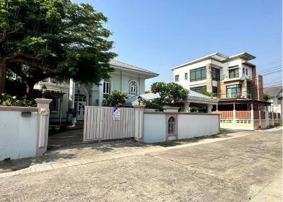 Exterior view of a residential home with gated entrance