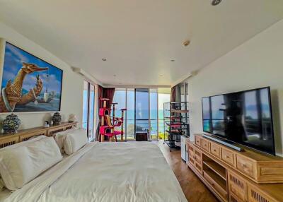 Spacious bedroom with artistic decor and ocean view