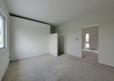 Spacious unfurnished bedroom with natural light