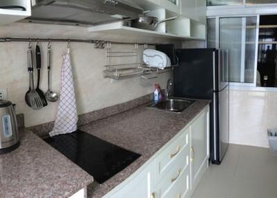 Modern kitchen with stainless steel appliances and granite countertops