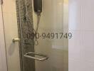 Modern tiled bathroom with wall-mounted electric shower