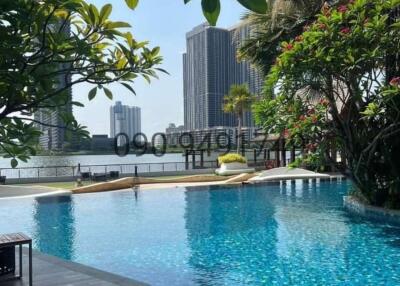 Luxurious outdoor swimming pool with city skyline view