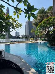 Luxurious outdoor swimming pool with city skyline view