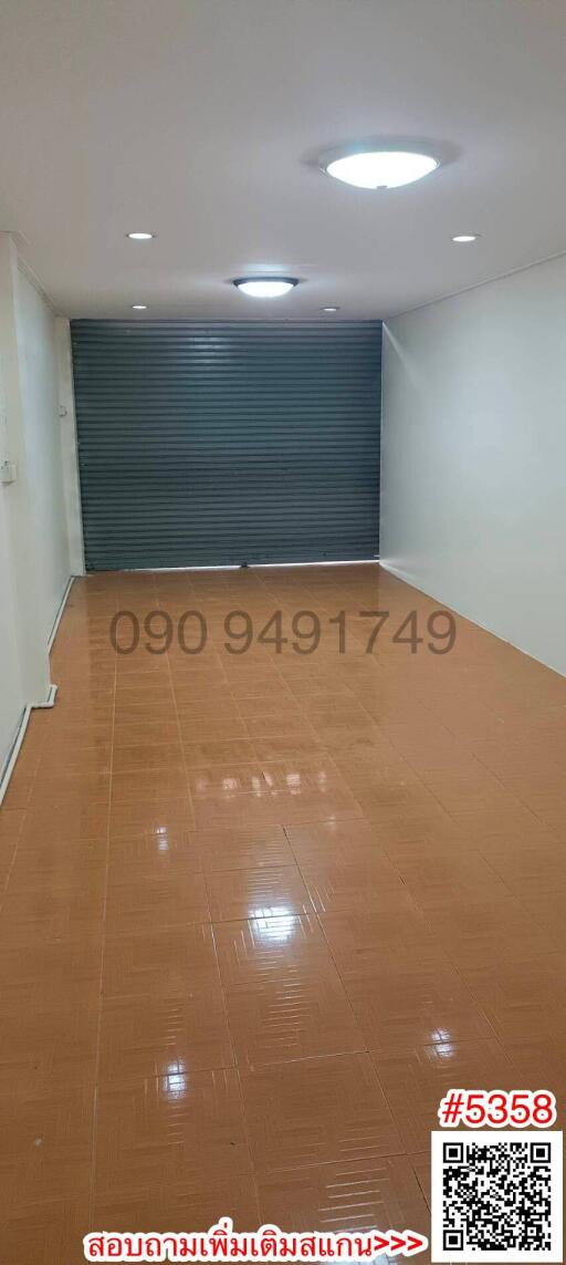 Empty interior space with tile flooring and shut window blinds